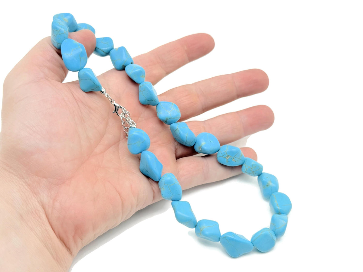 Turquoise jewelry set with crystal accents from GemstoneGO, featuring matching necklace and earrings on a white background.