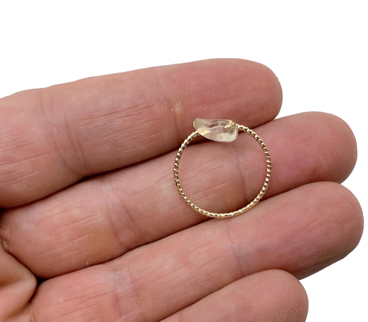 Dainty Gold Wire Rings with natural crystal gemstones, showcasing a mix of colorful gemstones on a delicate gold band.