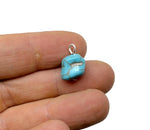 Turquoise crystal pendant with blue stones from GemstoneGO, showcasing a detailed close-up of the pendant's vibrant design.