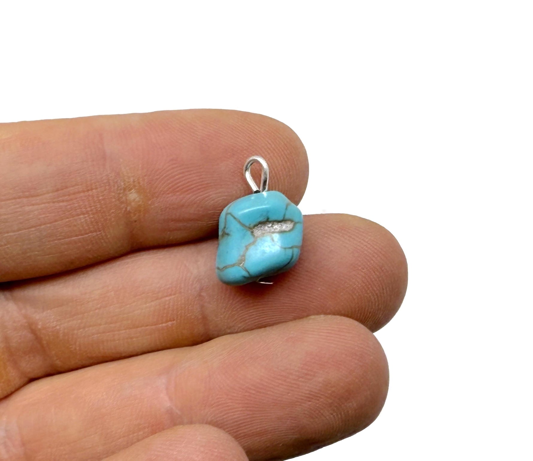 Turquoise crystal pendant with blue stones from GemstoneGO, showcasing a detailed close-up of the pendant's vibrant design.