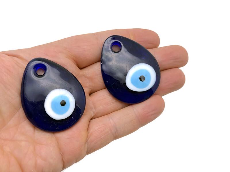 Blue glass evil eye charm with hole for hanging, Turkish Nazar protection amulet, decorative home decor from GemstoneGO