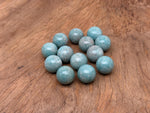 20mm Amazonite gemstone sphere, crystal ball showing vibrant blue-green color and natural stone pattern, by GemstoneGO.