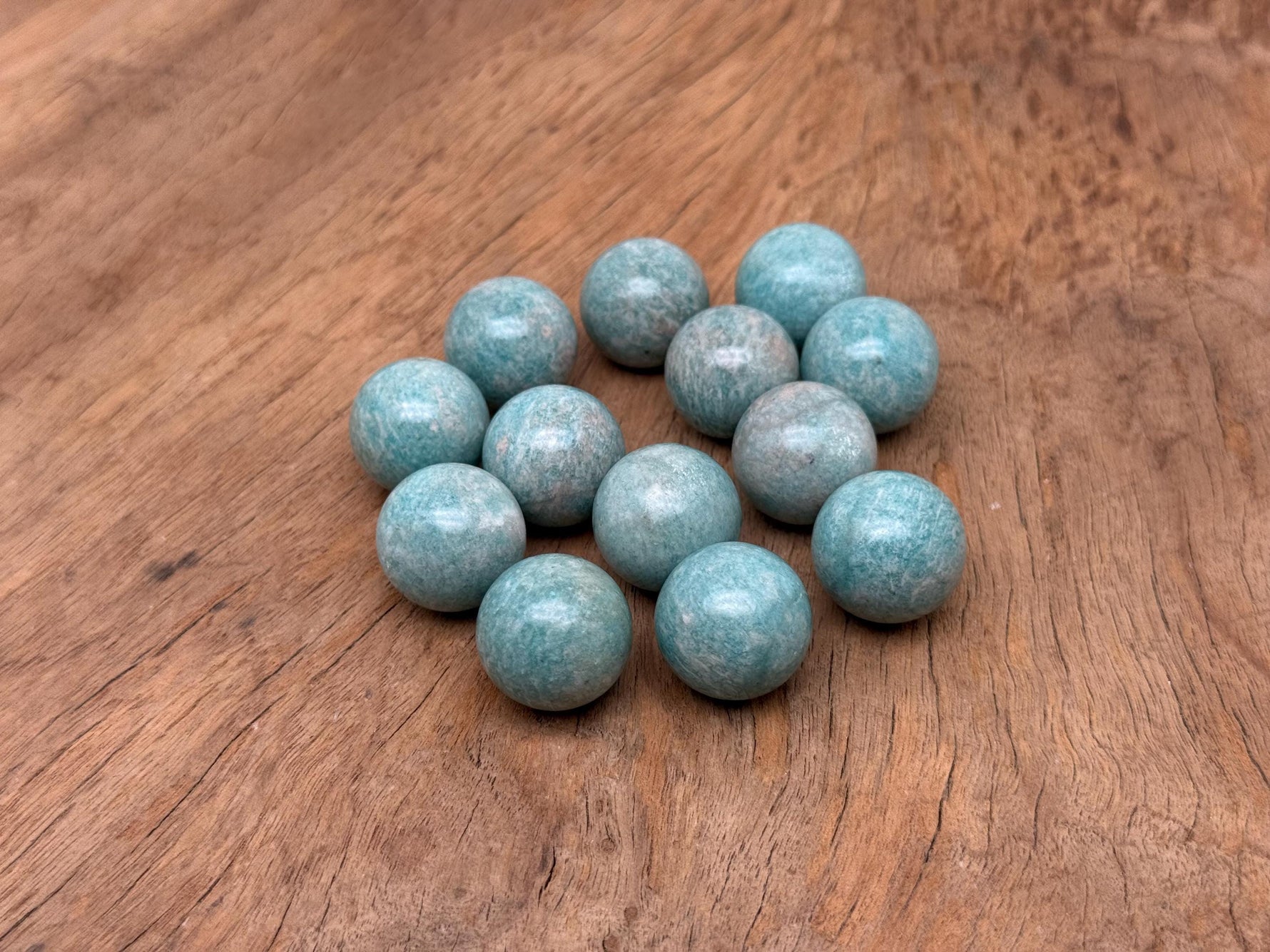 20mm Amazonite gemstone sphere, crystal ball showing vibrant blue-green color and natural stone pattern, by GemstoneGO.