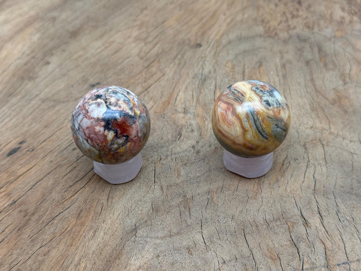 Crazy Lace Agate gemstone sphere, 40-50mm crystal ball from GemstoneGO, showcasing vibrant, intricate lace patterns and smooth polished surface.