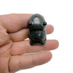 Handcrafted gemstone frog monster carving by GemstoneGO, detailed creature statue made from colorful crystals.