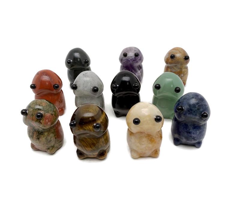 Handcrafted gemstone frog monster carving by GemstoneGO, detailed creature statue made from colorful crystals.