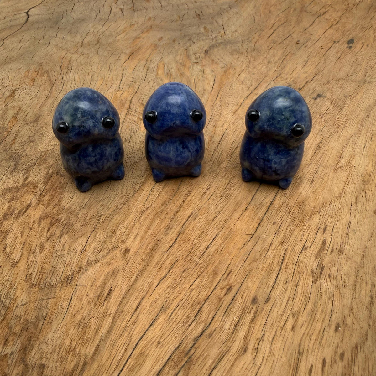Handcrafted Sodalite frog monster gemstone carving, detailed creature statue with vibrant blue and white mineral patterns.