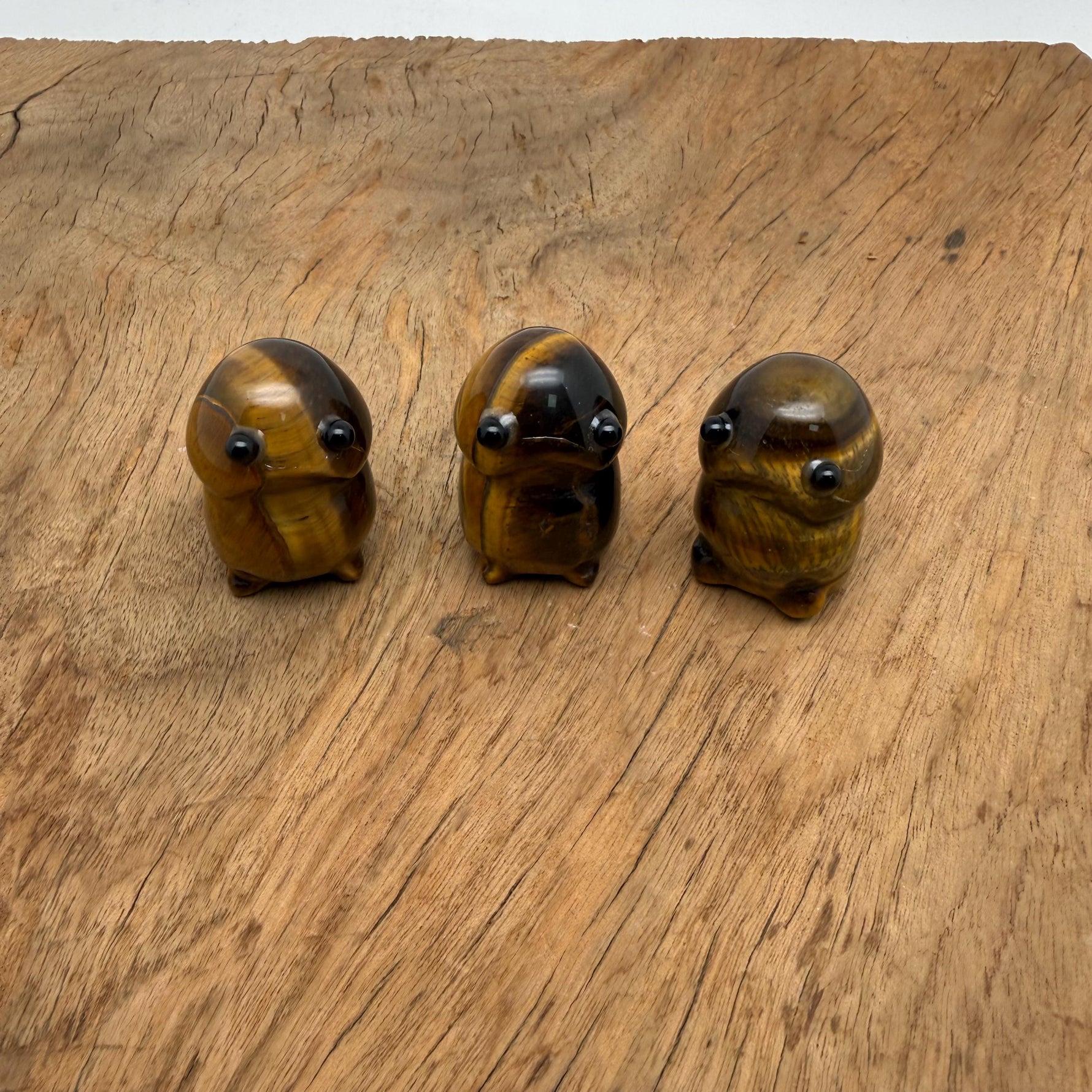 Handcrafted Tiger Eye Frog monster crystal carving by GemstoneGO, featuring detailed gemstone creature statue with rich tiger eye stone.