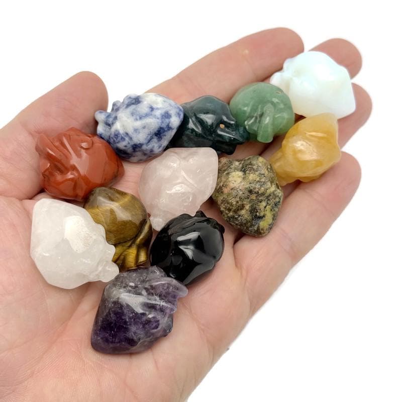 Handmade 30mm crystal heart figure by GemstoneGO, carved gemstone with colorful mix of hues and intricate details.