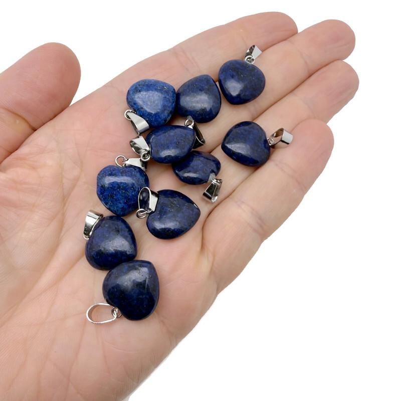 Lapis Lazuli heart-shaped pendant from GemstoneGO featuring a mini crystal design, showcasing deep blue and gold flecks.