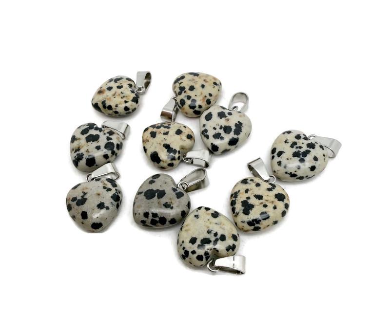 Dalmatian Jasper heart-shaped pendant from GemstoneGO featuring a mini crystal design, showcasing black and cream spotted gemstone.