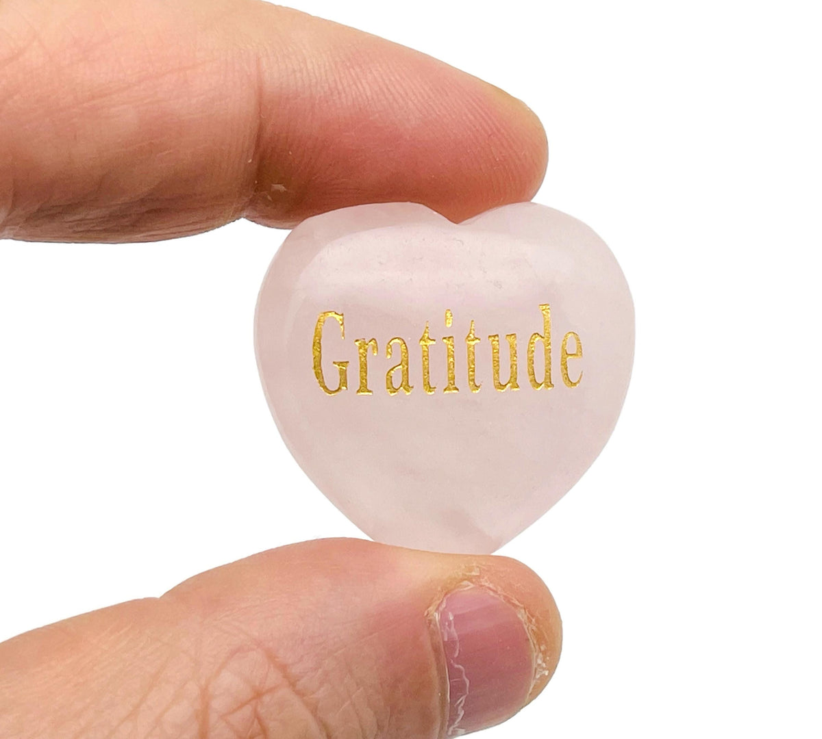 Rose Quartz Heart engraved crystal by GemstoneGO showcasing a polished pink stone with engraved symbols of love, trust, and strength.