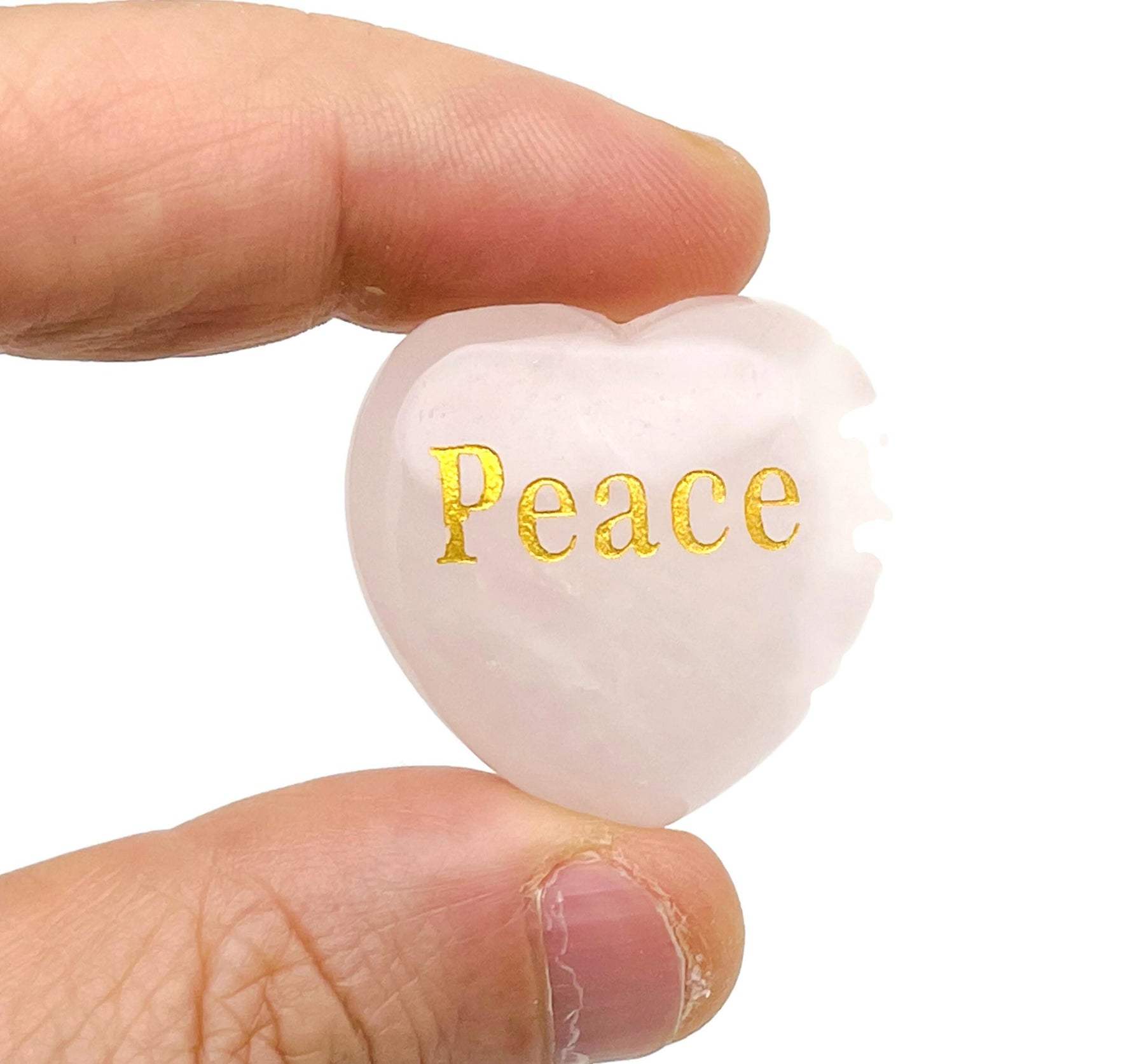 Rose Quartz Heart engraved crystal by GemstoneGO with symbols for love, trust, strength, kindness, peace, and happiness.