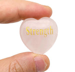 Rose Quartz Heart engraved crystal from GemstoneGO, showcasing a polished pink stone engraved with symbols of love, trust, and peace.
