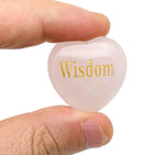 Rose quartz heart engraved crystal by GemstoneGO showcasing a pink gemstone with engraved symbols symbolizing love, trust, and peace.