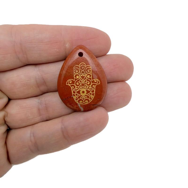 Engraved Hamsa hand crystal necklace by GemstoneGO, drilled for protection, luck, and spiritual energy.