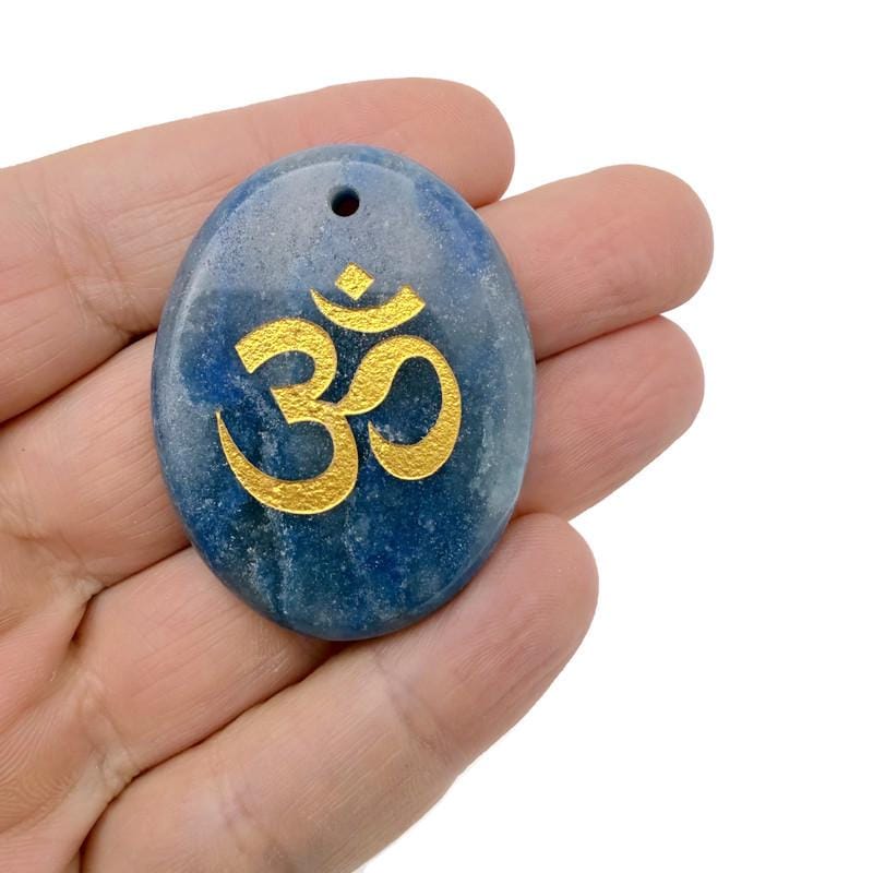Crystal pendant engraved with Om symbol, drilled for necklace, featuring spiritual Aum design for guidance and insight.