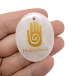Healing Hands engraved crystal amulet by GemstoneGO, drilled energy healer gift with intricate design and polished gemstone appearance.