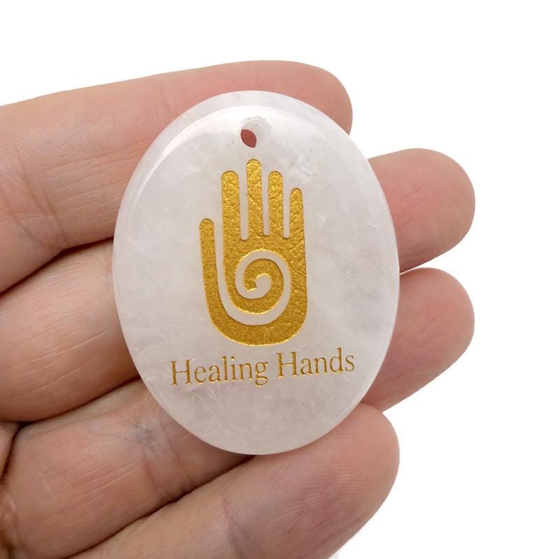 Healing Hands engraved crystal amulet by GemstoneGO, drilled energy healer gift with intricate design and polished gemstone appearance.