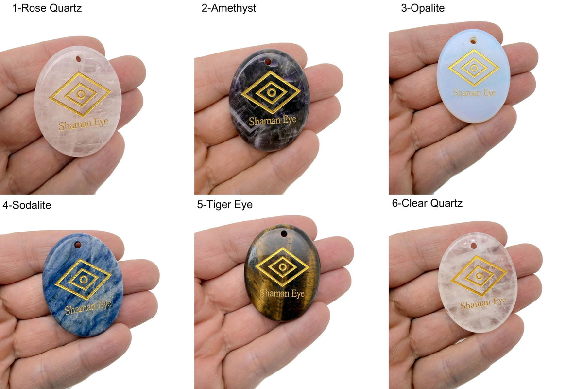 Shaman Eye engraved crystal from GemstoneGO, drilled for intuitive energy protection, showcasing intricate carvings and polished surface.