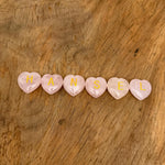 Rose quartz engraved crystal letter heart with personalized initial, crafted by GemstoneGO, featuring a polished crystal heart with engraved initial.