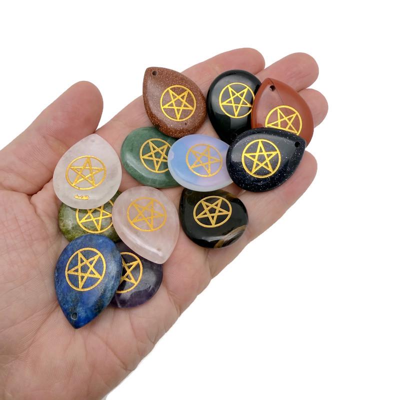 Pentagram engraved crystal from GemstoneGO, drilled for Pagan protection and balance, with intricate engraved design.
