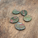 Unakite worry stone from GemstoneGO, 45mm smooth crystal with green and pink hues for calming and stress relief.