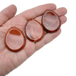Red Jasper worry stone with a smooth, polished 45mm crystal from GemstoneGO, showcasing its vibrant red color and rounded shape.