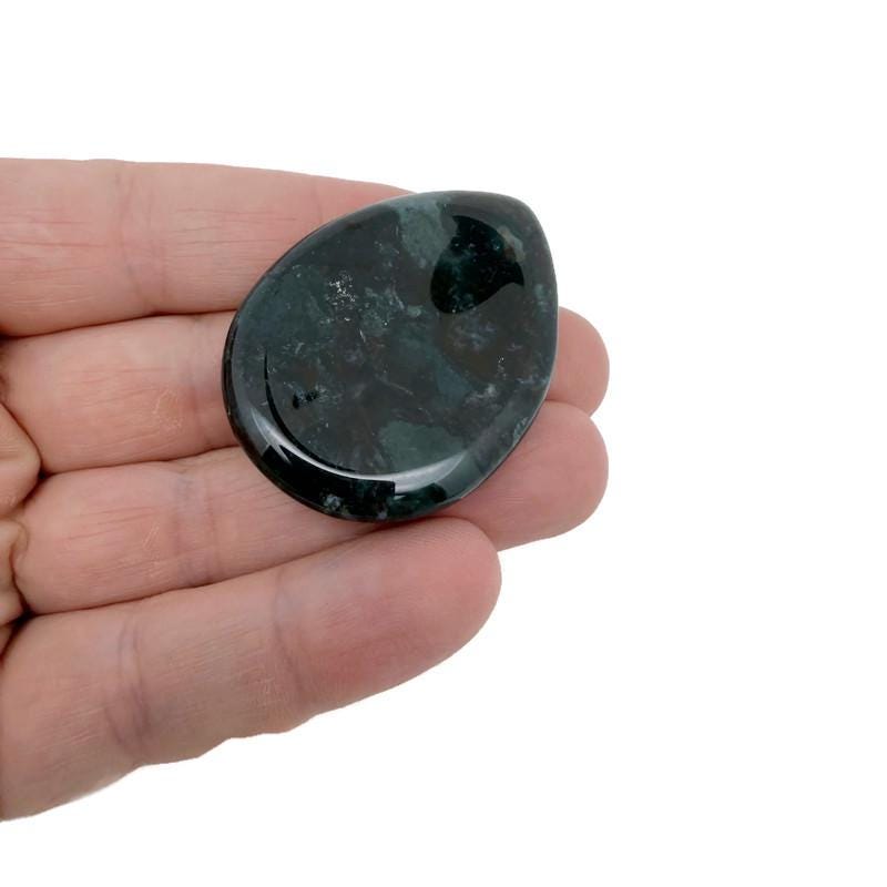 Moss agate worry stone from GemstoneGO, 45mm soothing crystal with natural green and brown patterns for calming use.