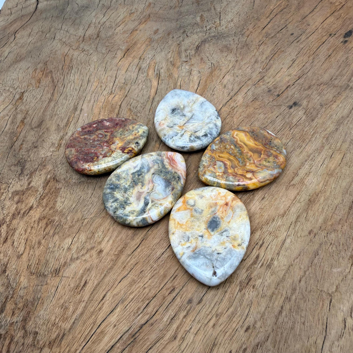 Crazy Lace Agate worry stone from GemstoneGO, 45mm smooth crystal for calming and stress relief, with intricate lace-like patterns.