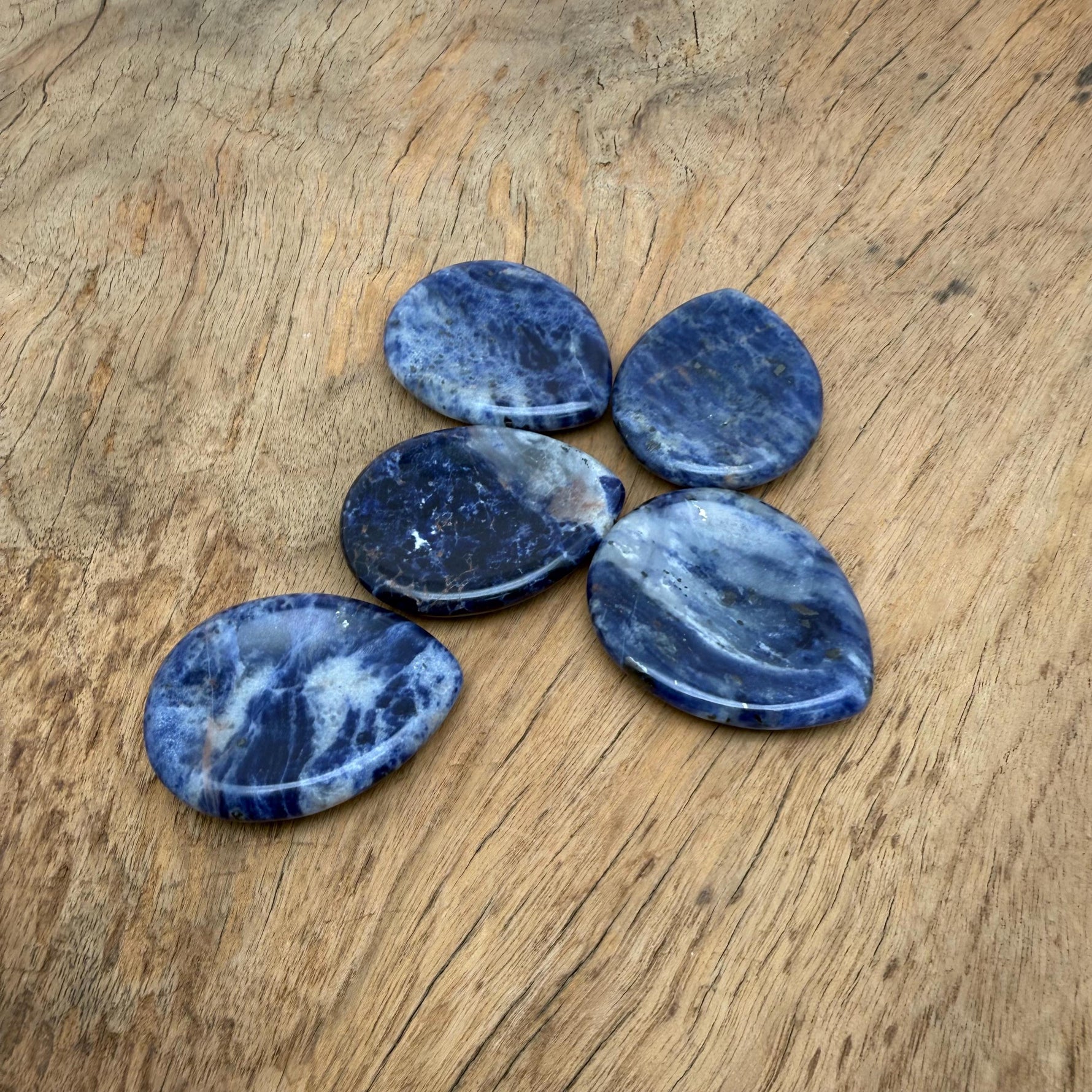 Sodalite worry stone from GemstoneGO, 45mm soothing crystal with polished blue and white mineral patterns.