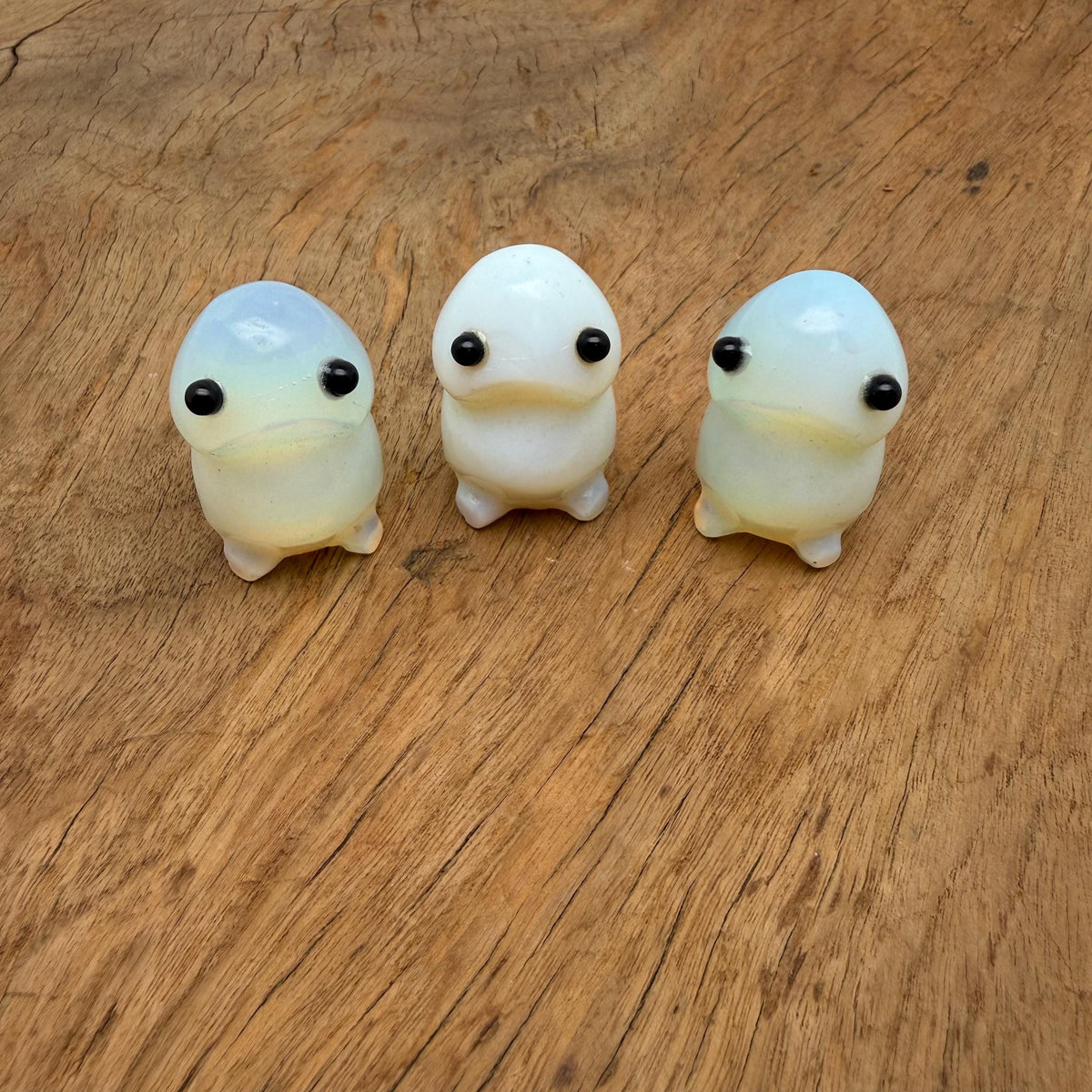Opalite frog monster carved gemstone statue, handcrafted creature sculpture with vibrant, translucent gemstone details.
