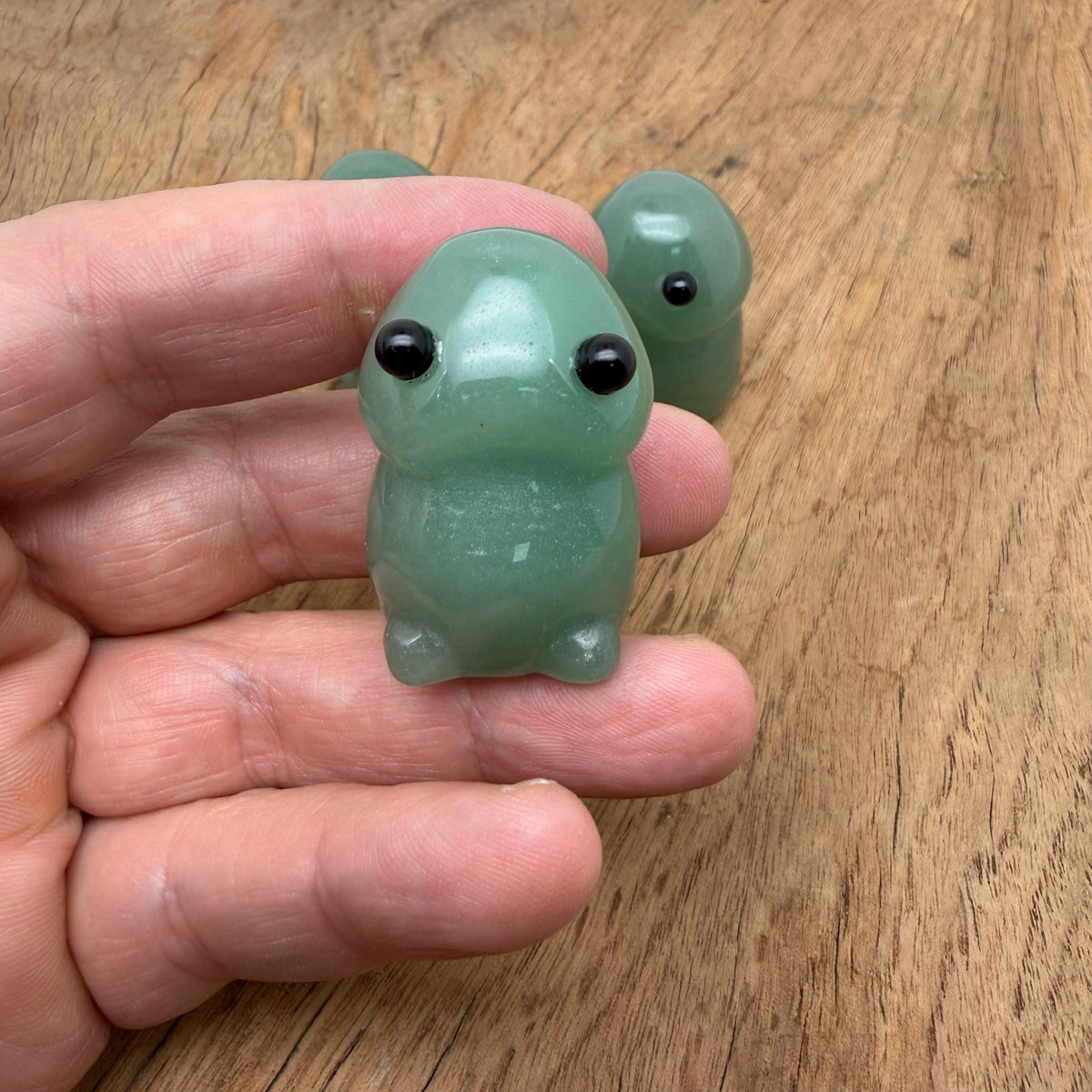 Handcrafted aventurine frog monster gemstone carving, detailed creature statue with vibrant green hues and polished finish.