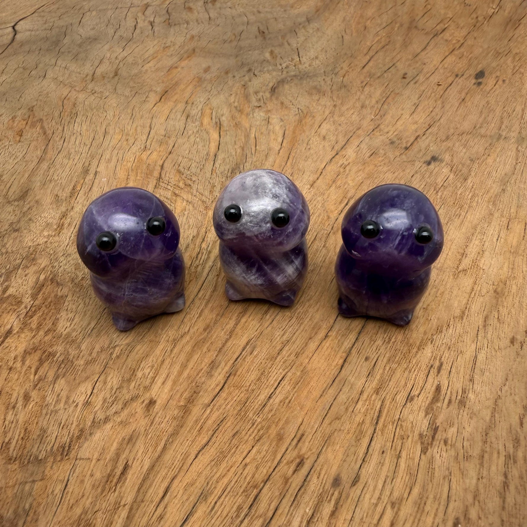 Handcrafted amethyst frog monster gemstone carving, detailed creature statue with vibrant purple hues from GemstoneGO.