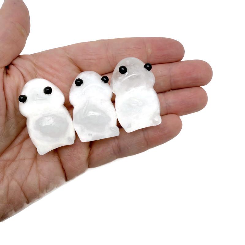 Handcrafted clear quartz frog gemstone carving with detailed features, showcasing a whimsical creature statue from GemstoneGO.
