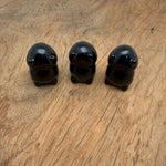 Handcrafted obsidian frog monster gemstone carving with detailed features, displayed as a creature statue.