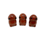 Red Jasper frog monster crystal carving by GemstoneGO, a handcrafted gemstone creature statue with detailed features and vibrant red color.