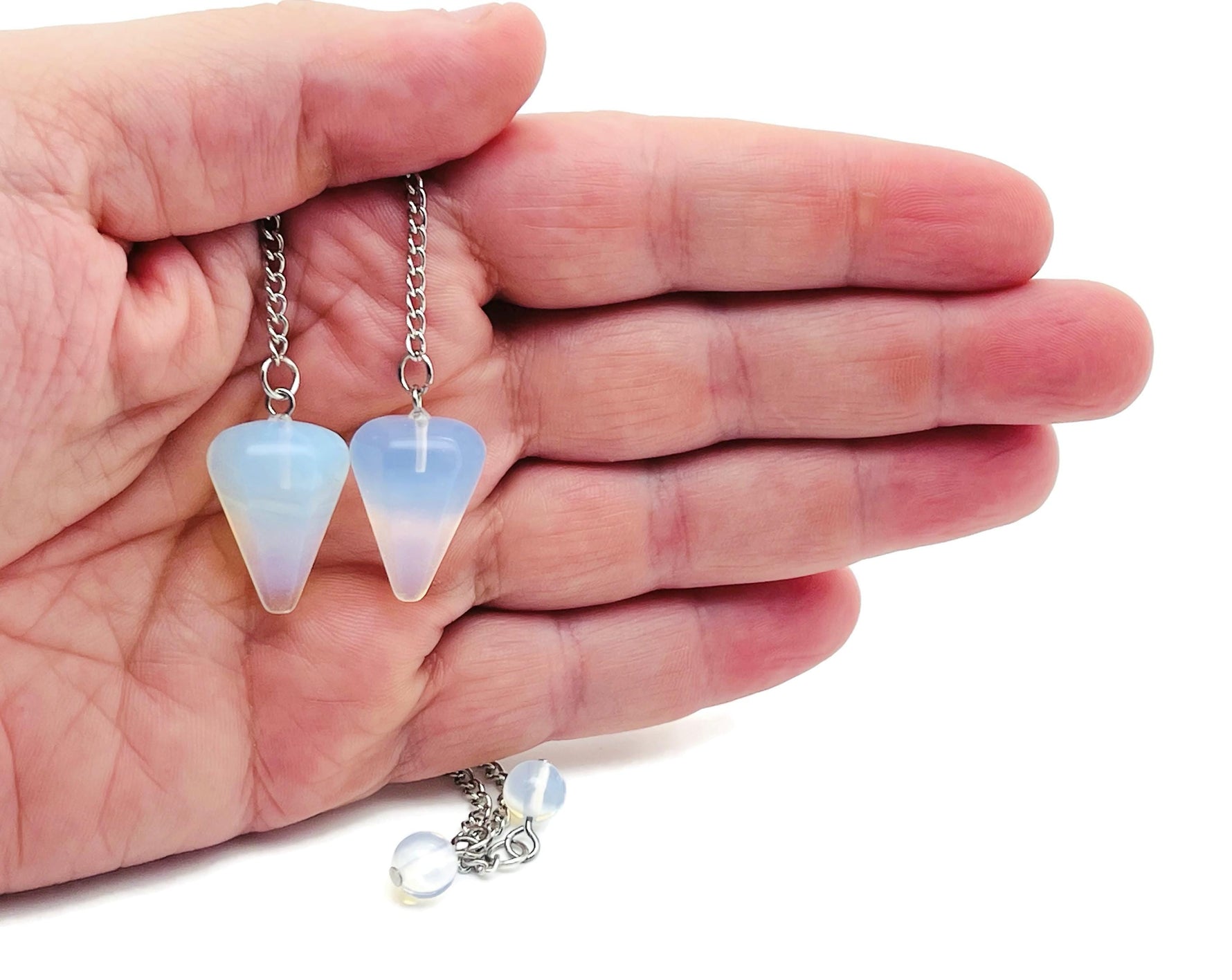 Healing crystal pendulum with stainless steel chain from GemstoneGO featuring a polished gemstone crystal for divination and energy healing.