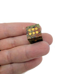 Polished gemstone crystal dice from GemstoneGO, carved for metaphysical use and gaming, featuring vibrant colors and intricate patterns.