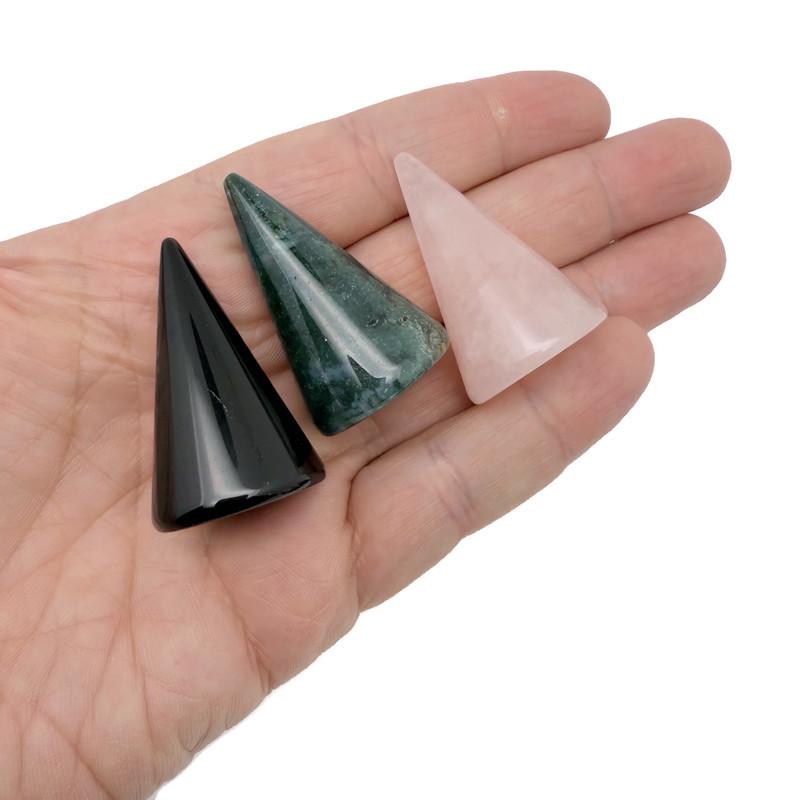 Carved gemstone cone ring holder displaying multiple rings on a jewelry display stand by GemstoneGO