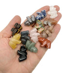 Handmade 30mm gemstone crystal bear animal figure by GemstoneGO, carved with colorful details on a neutral background.