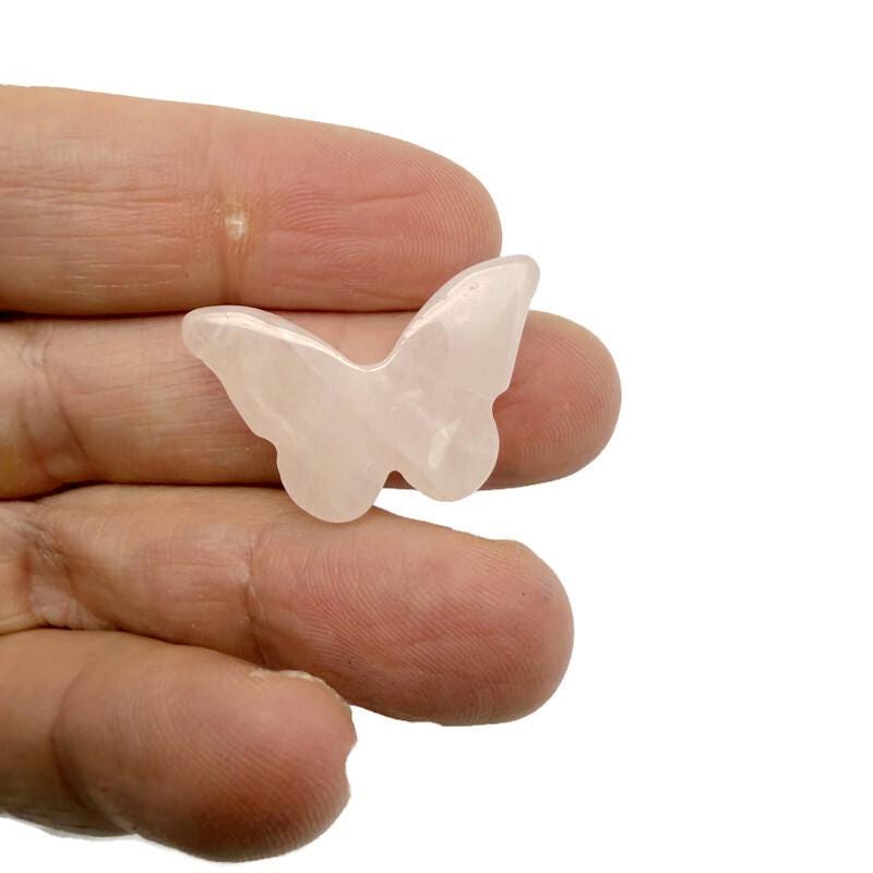 Handmade 30mm crystal butterfly beads with animal figure carvings from GemstoneGO, featuring drilled holes for jewelry making.