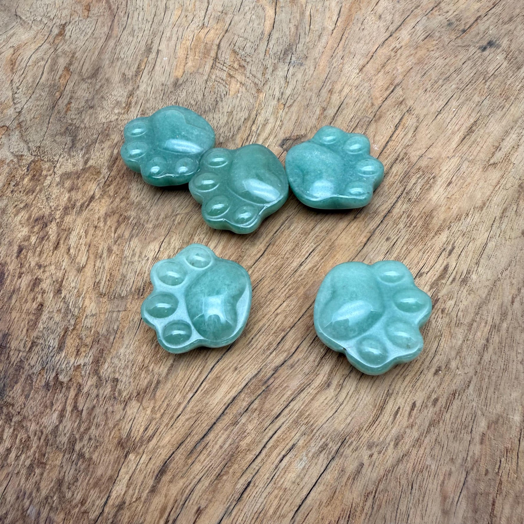 A 30mm Aventurine Bear Paw crystal carving by GemstoneGO, showcasing a smooth green gemstone with detailed paw features.