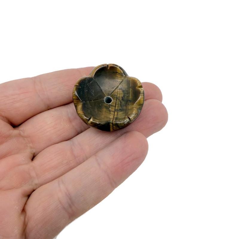 Tiger Eye crystal carving incense holder shaped like a flower, designed for burning incense and promoting relaxation and cleansing.