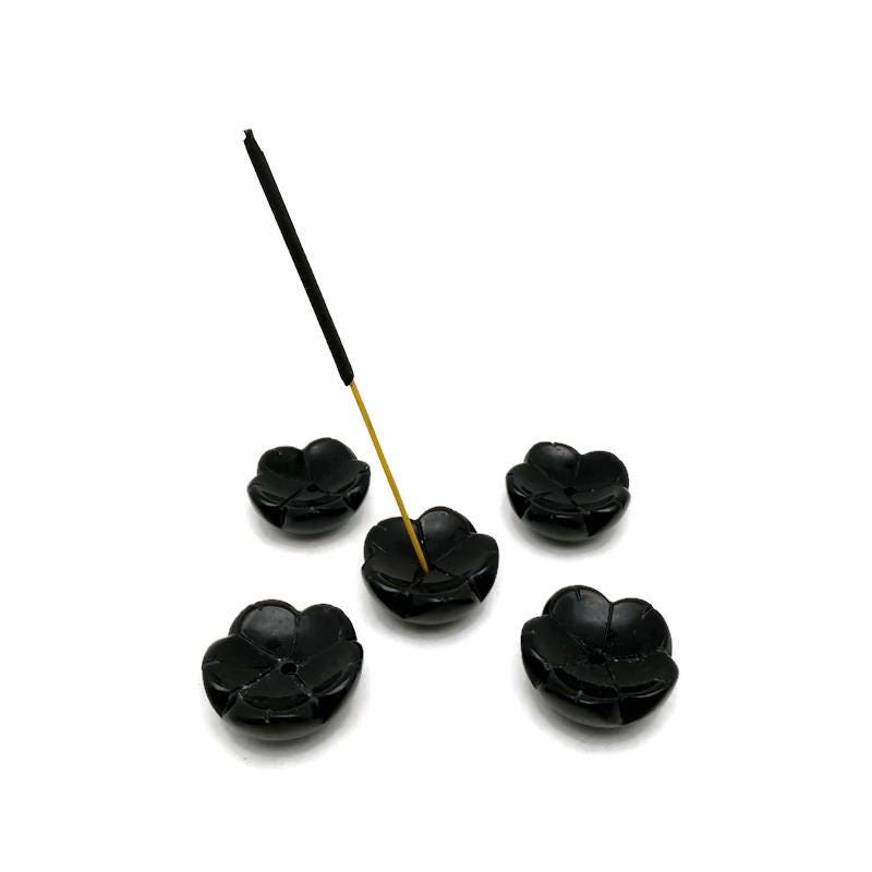 Obsidian crystal flower-shaped incense holder from GemstoneGO, designed for cleansing and relaxation with a polished, decorative appearance.