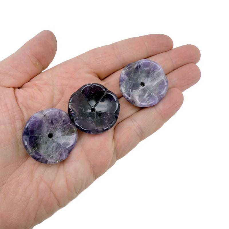 Amethyst crystal flower-shaped incense holder from GemstoneGO, designed for cleansing and relaxation with intricate carved details.