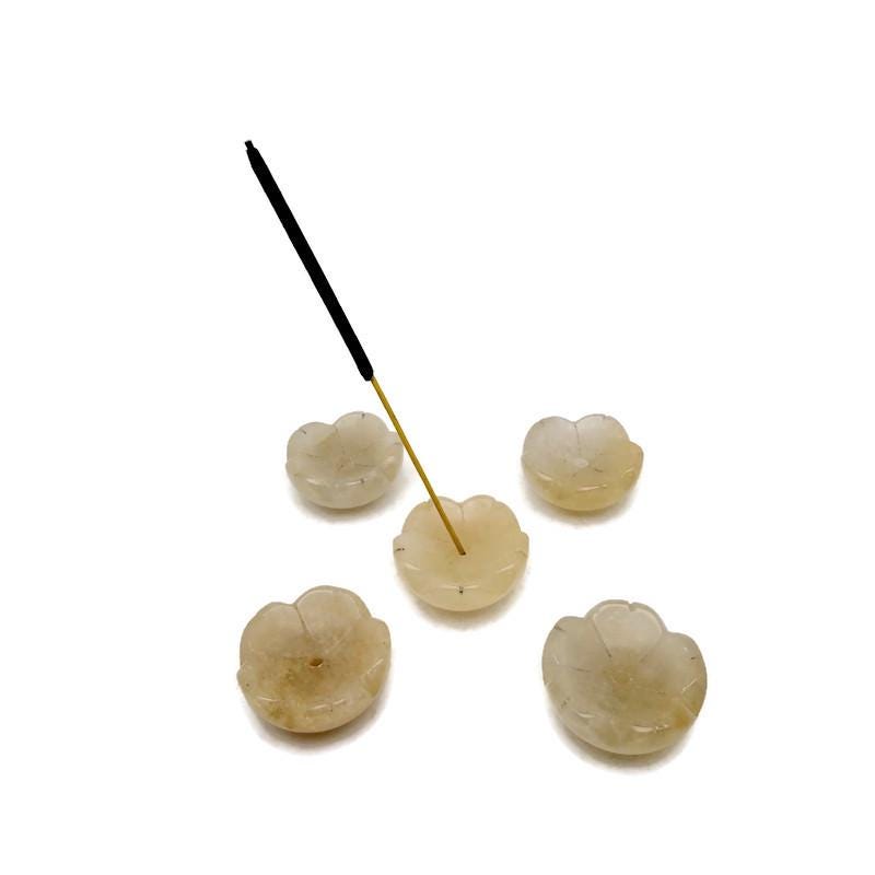 Yellow jade crystal flower incense holder from GemstoneGO, designed for cleansing and relaxation with a detailed flower carving.