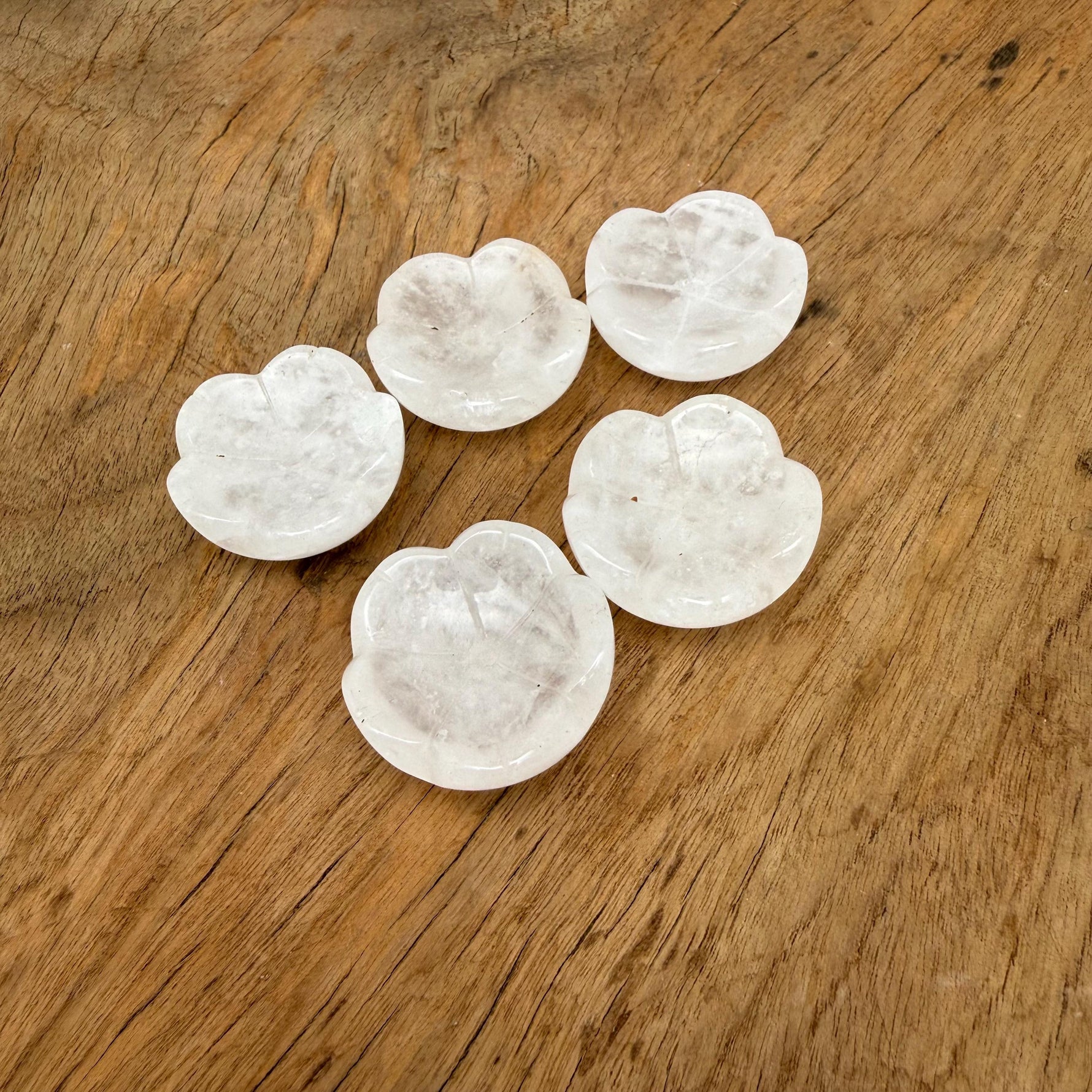 Clear quartz crystal carving incense holder in flower shape from GemstoneGO, designed for cleansing and relaxation.