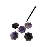 Amethyst natural crystal flower incense holder with carved gemstone design, used for meditation and burning incense sticks.