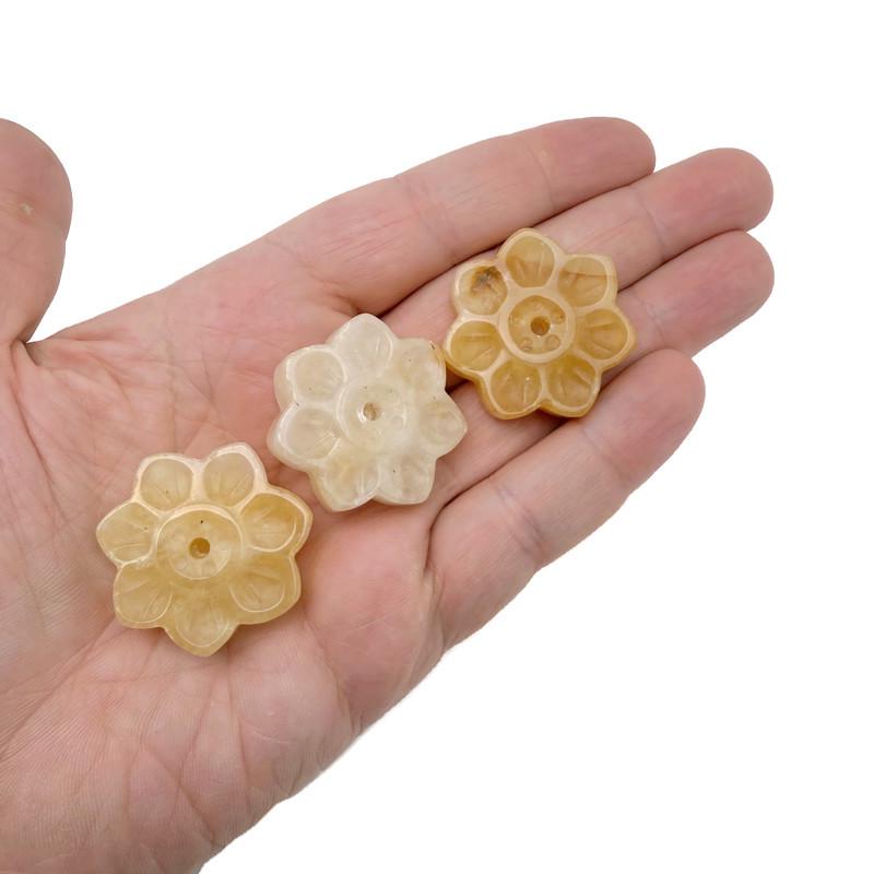Yellow jade crystal flower incense holder with carved gemstone design, ideal for meditation and burning incense sticks.
